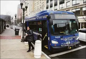  ?? Tyler Sizemore / Hearst Connecticu­t Media ?? Stamford's Michelle Darden gets off the 331 bus on Main Street in Stamford last week. Gov. Ned Lamont announced a bus holiday alongside the gas tax holiday he signed into effect this month.