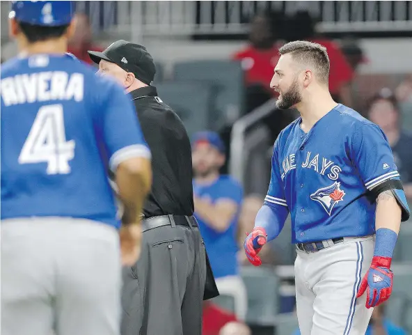  ??  ?? Toronto Blue Jays centre-fielder Kevin Pillar, right, said he is ‘completely and utterly embarrasse­d’ for directing an anti-gay slur at Braves relief pitcher Jason Motte Wednesday during a loss in Atlanta. Pillar was given a two-game suspension by the...