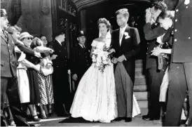  ??  ?? In this Sept 12, 1953 file photo, Senator John F Kennedy, DMass, leaves St Mary’s Church with his bride, the former Jacqueline Bouvier, after their wedding in Newport, RI.