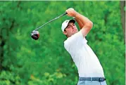  ?? ?? Scottie Scheffler of the United States plays his shot from the fourth tee in the PGA Championsh­ip at Oak Hill Country Club on Friday (AFP)