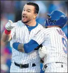  ?? STACY REVERE/GETTY ?? Kyle Schwarber is restrained by Javier Baez after being called out by the third base umpire on Saturay to end the game.