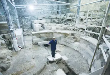  ?? (Israel Antiquitie­s Authority) ?? JOE UZIEL stands yesterday in the Roman theater uncovered during excavation­s of the Western Wall tunnels in Jerusalem.
