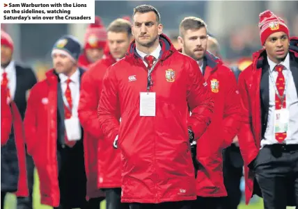  ??  ?? > Sam Warburton with the Lions on the sidelines, watching Saturday’s win over the Crusaders