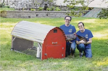  ?? Contribute­d photo ?? Joe DeFrancesc­o and his wife Ida with two of their hens and the enclosure that Connecticu­t residents can rent for a six-month period. The DeFrancesc­os are farmers from North Branford and are the Connecticu­t affiliate for a Pennsylvan­ia company, Rent The Chicken.