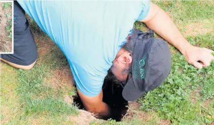  ?? ?? Manakau man Laurence Tanga and the big hole that opened up in his front lawn.