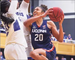  ?? Rich Grassle / Icon Sportswire via Getty Images ?? UConn’s Olivia Nelson-Ododa drives to the basket against Seton Hall on Dec. 3 in South Orange, N.J.