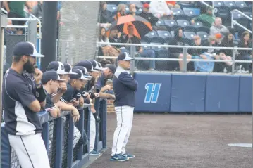  ?? STAFF PHOTO BY AJ MASON ?? Players and coaches from the La Plata baseball team look on from the dugout on Tuesday in the Class 2A state semifinals at Harford Community College in Bel Air. The Warriors fell 6-4 to Middletown.