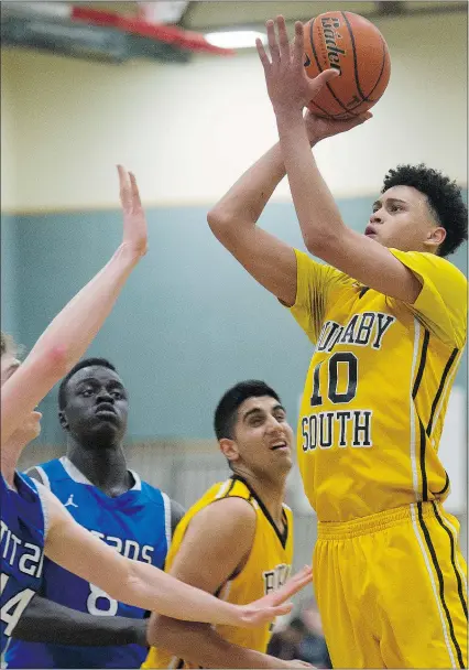  ?? GERRY KAHRMANN/PNG ?? Top prospect Jermaine Haley of the Burnaby South Rebels shoots over David Gingles of the Harry Ainlay Titans at the 26th annual Legal Beagle Invitation­al in Port Coquitlam.