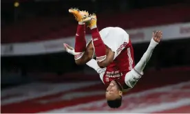  ?? Photograph: Catherine Ivill/Reuters ?? Pierre-Emerick Aubameyang takes off in celebratio­n after scoring the first of his two goals against Newcastle.