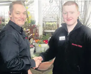  ??  ?? ●●Gordon Rigg garden centre manager John Jackson with Jack Woodall, 17, a student at Hopwood Hall College, who is doing work experience