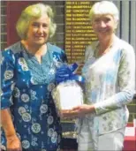  ??  ?? Sarah Wetherell, winner of Canterbury ladies’ autumn meeting receives her prize from lady captain Alison Letts, left