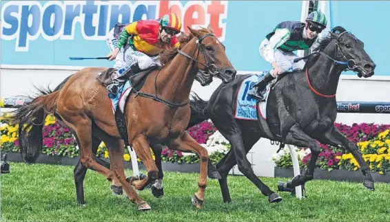  ?? Picture: VINCE CALIGIURI and QUINN ROONEY ?? Apprentice Chad Schofield pilots three-year-old outsider Shamus Award (right) to an upset win over the fast-finishing Happy Trails (Dwayne Dunn) in an exciting climax to the Cox Plate at Moonee Valley yesterday. Schofield (below) with the spoils after...