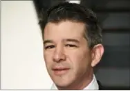  ?? PHOTO BY EVAN AGOSTINI/INVISION/AP, FILE ?? Uber CEO Travis Kalanick resigned under pressure from investors at a pivotal time for Uber. Uber’s board confirmed the move June 21, saying in a statement that Kalanick is taking time to heal from the death of his mother in a boating accident “while...