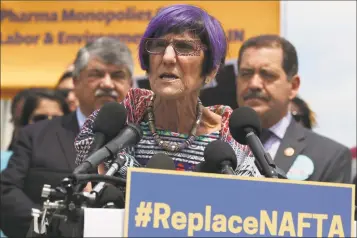  ?? Alex Wong / Getty Images ?? U.S. Rep. Rosa DeLauro, D3, speaks as Rep. Jesus Garcia, DIll., right, and AFLCIO President Richard Trumka listen during a news conference in front of the U.S. Capitol in Washington, D.C., on June 25.