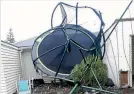  ??  ?? Grace Gatenby came home to find her son’s new secured trampoline had taken out her clotheslin­e and sat against her house.