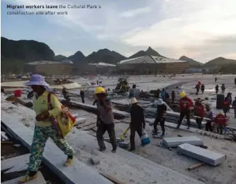  ??  ?? Migrant workers leave the Cultural Park's constructi­on site after work