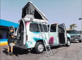  ?? TNS ?? At Escape Campervans in Inglewood, California, North America’s largest camper van rental company, a Ford E-150 with roof sleeper stands ready to hit the road.