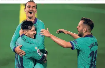  ?? AFP ?? Big question mark: Barcelona talisman Lionel Messi celebrates a goal with teammates Antoine Griezmann and Jordi Alba. Despite rumours growing about Messi’s future in Spain, he shut out all the noise and let his feet do the talking on the pitch.