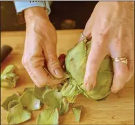  ??  ?? Remove any small, tough leaves toward the base on the stem of the artichoke.