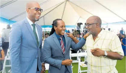  ?? IAN ALLEN/MULTIMDEA PHOTO EDITOR ?? The three members of parliament whose constituen­cies lie within Portmore (from left) Robert Miller of St Catherine South Eastern; Alando Terrelonge of St Catherine East Central; and Fitz Jackson, of St Catherine Southern, share a moment at the park launch.