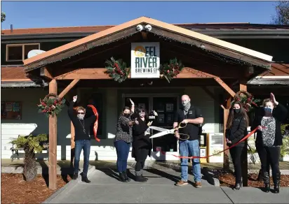  ?? MARY BULLWINKEL — FOR THE TIMES-STANDARD ?? A ribbon-cutting to celebrate the 25th anniversar­y of Eel River Brewing Company was held recently in Fortuna. Eel River Brewing Company representa­tives including Matt Vivatson, operations manager/brewer (holding big scissors), and the Fortuna Chamber of Commerce joined in the event.