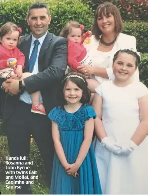  ??  ?? Hands full: Rosanna and John Byrne with twins Cáit and Mollaí, and Caoimhe and Saoirse