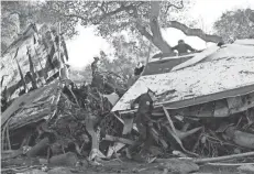  ?? MARCIO JOSE SANCHEZ/AP ?? Rescue personnel Saturday search a home in Montecito, Calif., destroyed by a mudslide.