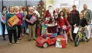  ??  ?? Some of the John Daugherty, Realtors team answering the call for holiday gift support for Child Advocates included (left to right) Kathy Dreyfus, Judy Berry, Shari Schiffman, Vicki Lehner, Margo Cunningham, Debbie Hartstern, Jan Greer, Rob Ginn,...