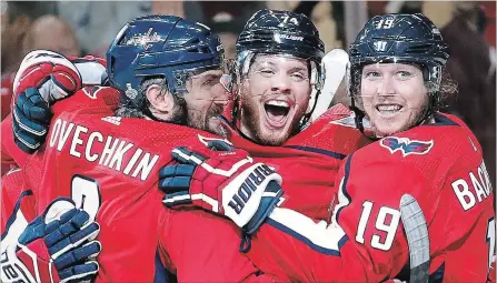  ?? ALEX BRANDON THE ASSOCIATED PRESS ?? Capitals defenceman John Carlson, centre, celebrates his goal against the Vegas Golden Knights with Alex Ovechkin, left, and Nicklas Backstrom in the second period in Game 4 of the Stanley Cup final Monday night in Washington. The Caps head back to...