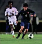  ?? ?? Centennial's Julian Garcia kicks the ball in a District 10-7A boys semifinal against Treasure Coast Monday at the South County Regional Sports
Regional Complex in Port St. Lucie.