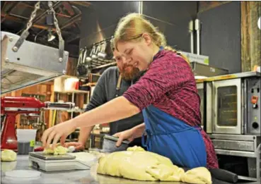  ?? SUBMITTED PHOTO ?? Grayson Norbury prepares pizza dough while Terrain Chef Ryan Bloome watches.