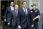  ?? RICHARD DREW — THE ASSOCIATED PRESS ?? President Donald Trump’s personal attorney Michael Cohen, right, leaves Federal Court, in New York, Wednesday. U.S. District Judge Kimba Wood said at a hearing Wednesday that she had to balance the needs of lawyers for Cohen and Trump with the needs of...