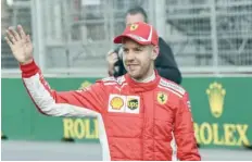  ?? — AFP ?? Ferrari’s Sebastian Vettel celebrates his pole position following the qualifying session for the Azerbaijan Grand Prix at the Baku City Circuit in Baku on Saturday.