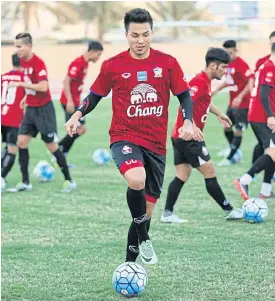  ??  ?? Thailand midfielder Charyl Chappuis trains with teammates in Abu Dhabi.