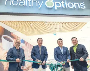  ??  ?? Healthy Options founders founders Romy Sia (second from left) and Christian Tan (right) with Megaworld Properties CEO Kevin Tan (third from left),Stories Design-France managing director Dan Otmezguine (left)