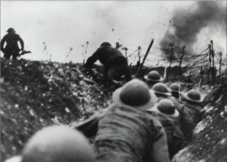  ??  ?? World War One. 1914 - 1918. Western Front, France. 1916. British troops go over the top in the trenches during the battle of the Somme.