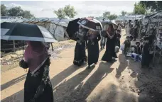  ?? Photos Campbell MacDiarmid / The National ?? Rohingya in a refugee camp near Cox’s Bazar in Bangladesh must wait as authoritie­s prevaricat­e