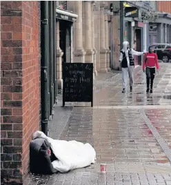  ??  ?? > The council will scale homeless cuts back by £2 million