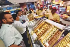  ?? Virendra Saklani/Gulf News ?? Residents buying sweets in Karama ahead of Diwali.