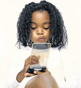  ?? Picture: THINKSTOCK ?? SPELLBOUND: Parents believe playing with phones and tablets should be balanced by spending more time outdoors and being active