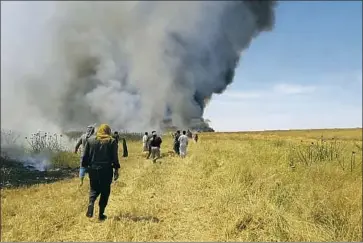  ?? Together for Jarniyah ?? IN RAQQAH province, fields were also set ablaze. Most of Raqqah’s residents rely on agricultur­e, and farmers were preparing for a good harvest, only to see it turned into a “black one,” said a member of a civil group.