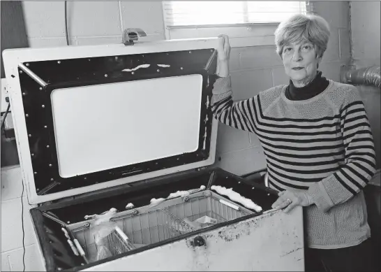  ?? [JOSHUA A. BICKEL/DISPATCH PHOTOS] ?? Susie Kanter displays a freezer that her parents bought in 1944.