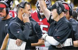  ?? CURTIS COMPTON / CCOMPTON@AJC.COM ?? Falcons offensive coordinato­r Steve Sarkisian (left), seen Sunday with coach Dan Quinn, helped Atlanta stack 442 yards vs. Carolina’s defense.