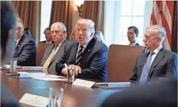  ?? EVAN VUCCI, AP ?? President Trump meets with members of his Cabinet. The president aims for a short-term health care “fix” this year and a major overhaul next year.