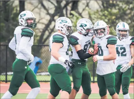  ?? MEDIANEWS GROUP PHOTO ?? Pennridge players celebrate around Shane Hartzell (40) after he returned a blocked punt for a touchdown in a game against Central Bucks East last season.