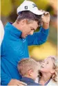  ?? —AP ?? Charles Howell looks at his children Charles and Ashley after winning the final round of the RSM Classic golf tournament on Sunday.