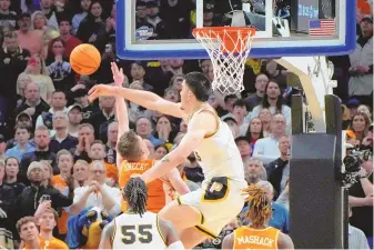  ?? ASSOCIATED PRESS ?? Purdue center Zach Edey blocks a shot by Tennessee guard Dalton Knecht in the final minute of the Boilermake­rs’ NCAA Tournament Elite 8 win on Sunday in Detroit.