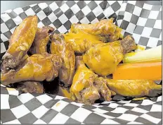  ?? Arkansas Democrat-Gazette/ERIC E. HARRISON ?? Wings are only a part of, and not even the main focus of, the menu at Jacobs Wings & Grill in North Little Rock.