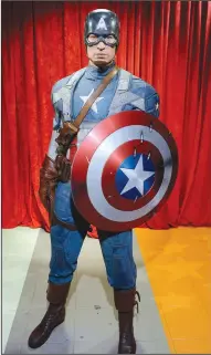  ?? OLIVIER DOULIERY/ABACA PRESS ?? The wax figure of Captain America, portrayed by Chris Evans in the 2011 movie “Captain America: The First Avenger,” stands at Madame Tussauds in Washington, D.C. in 2015. The movie is one of several that can be added to the list for a patriotic film...