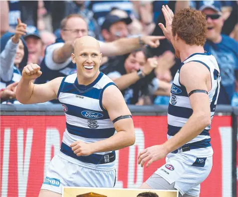  ?? Picture: QUINN ROONEY ?? ON FIRE: Gary Ablett, main, celebrates a goal with Gary Rohan yesterday.